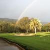 A view of the rainbow over a hole and the putting green at Castlewood Country Club.