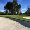 A view of a green protected by sand traps at Sunnyside Country Club.