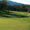 A view of a green and a cart path in background at Hidden Valley Lake Golf Course.