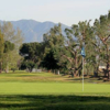 A sunny day view of a green at Whittier Narrows Golf Course.