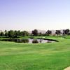 A view of a green with water and bunkers coming into play atBear Creek Golf & Country Club.