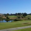 A sunny day view of a green at Cypress Ridge Golf Course.