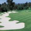 A view of the 17th fairway with an elegant bunker on the left side at Marbella Country Club.