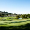 A view of a green and the clubhouse at Marbella Country Club.