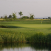 A view of a green with water coming into play at Wild Wings Golf Club.