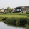 A sunny day view of a green at Wild Wings Golf Club.