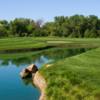 A view over the water of a hole at Los Lagos Golf Course.