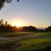 A sunset view of a green at Boundary Oak Golf Course.