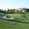 A view of a green surrounded by bunkers at The Golf Club at Copper Valley