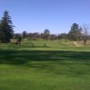 A sunny day view of a green at Napa Golf Course from Kennedy Park