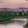 A sunset view of a green at Desert Course from The Vintage Club.