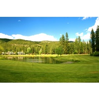 Plumas Pines Golf Resort's par-4 sixth hole plays downhill to a green guarded by water.