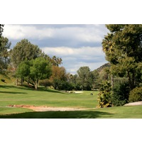 The par-5 third hole at Rancho Bernardo Inn is a dogleg right around trees. 