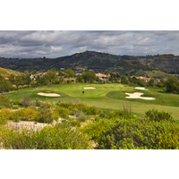 The seventh green at The Golf Club of California is protected by four sand bunkers.