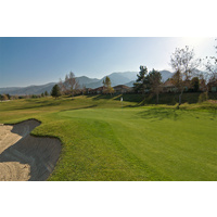 Glen Ivy Golf Club's second hole is a dogleg-left par 4. The green is elevated and protected by three sand bunkers.