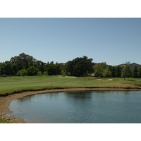 A large lake pinches in the fairway on the difficult par-4 sixth at Paradise Valley Golf Course in Fairfield, California.