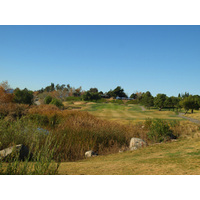 The ninth hole at The Golf Club at Rancho California is a medium-length par 4 with water down the left side.