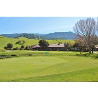 San Juan Oaks Golf Club's ninth green sits near the sprawling clubhouse. 