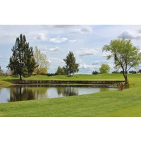 The par-4 sixth hole at Bartley Cavanaugh Golf Course boomerangs around a pond. 