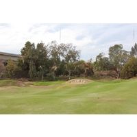 Some tricky mounding and bunkering built by Perry Dye guard the short, 312-yard fifth hole at Carlton Oaks Golf Club just northeast of San Diego.